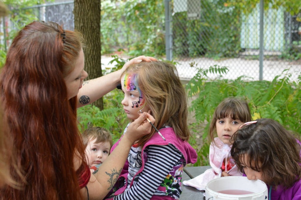 April-Anna face painting a child